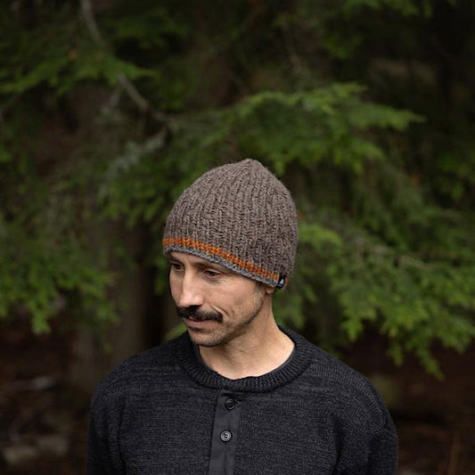 Man wearing Ambler Andrew handknit men's toque in heather brown.