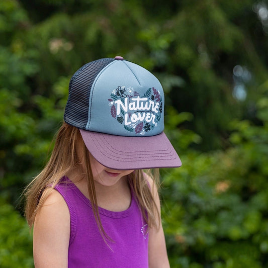 Girl wearing a kids' trucker hat with purple brim, black mesh back and a 'Nature Lover' text and leaf graphic on the front panel.