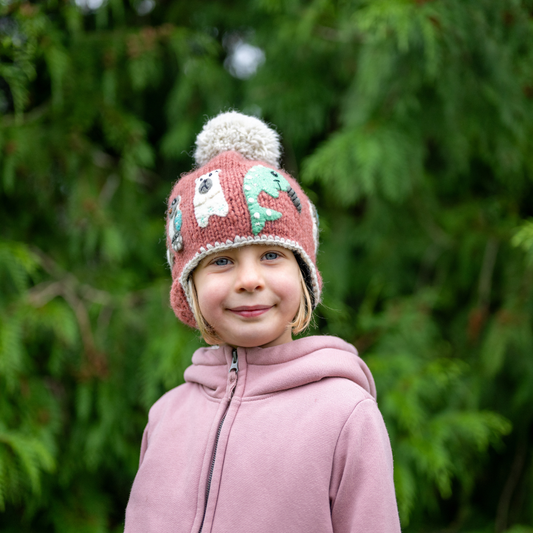 Ambler Yeti handknit kids' toque in terracotta with felted creatures and medium pom.