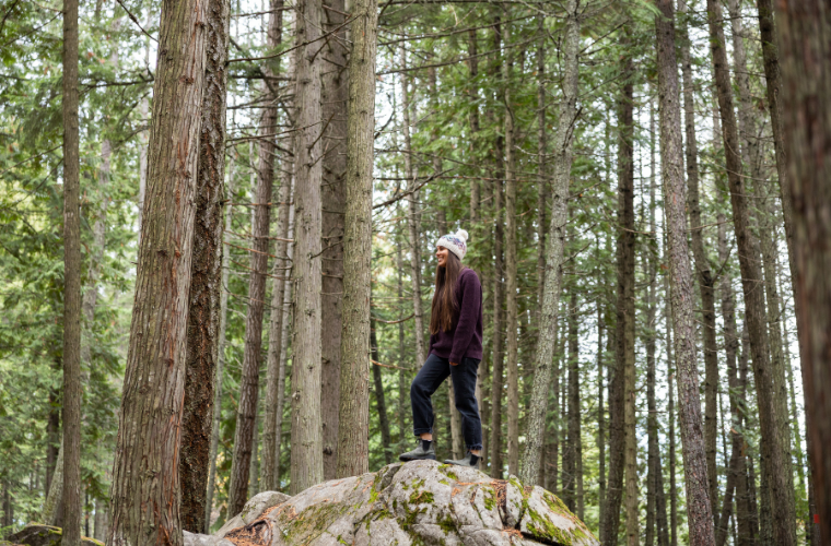 Lady in the forest wearing an Ambler toque