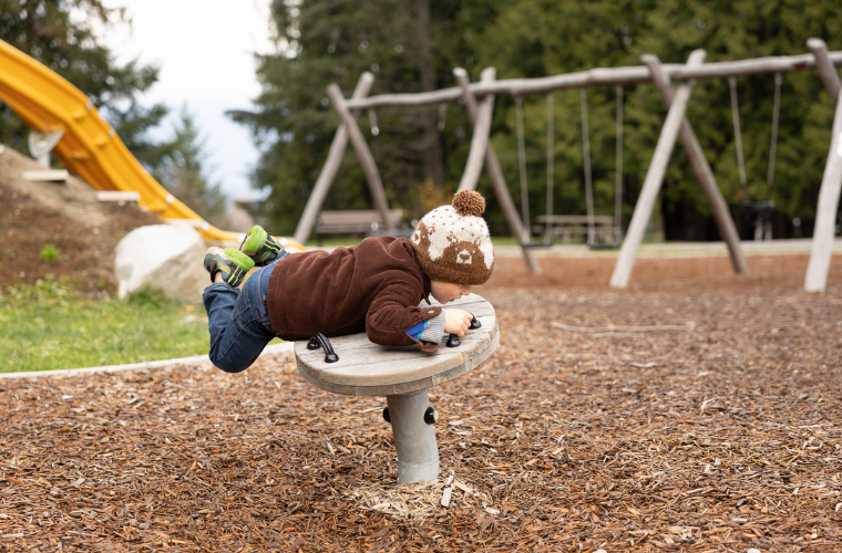 Kid at the playground wearing an Ambler toque