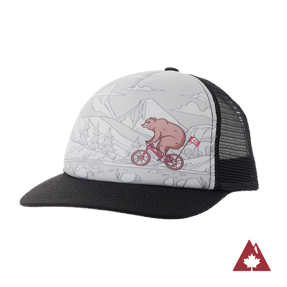 Kids' trucker hat with bear riding a bike design on a white background. 