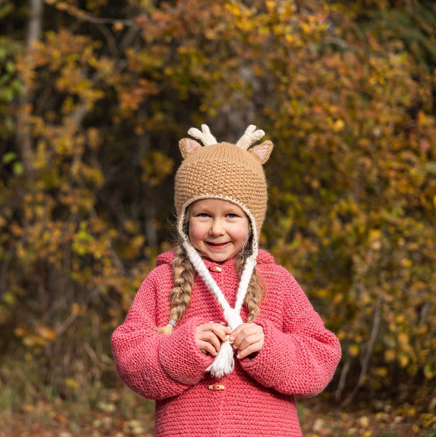 Ambler Forest handknit kids' toque in deer with knitted deer ears and coloured tassels. 