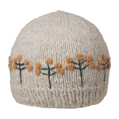 Ambler Marigold handknit women's toque in apricot with textured floral pattern and ribbed cuff. 