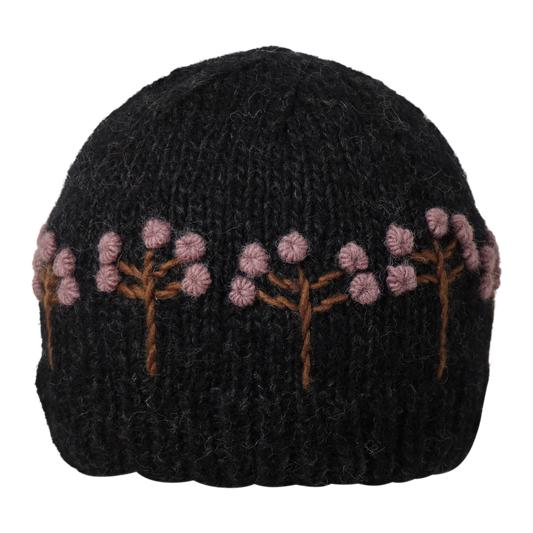 Ambler Marigold handknit women's toque in wild ginger with textured floral pattern and ribbed cuff. 