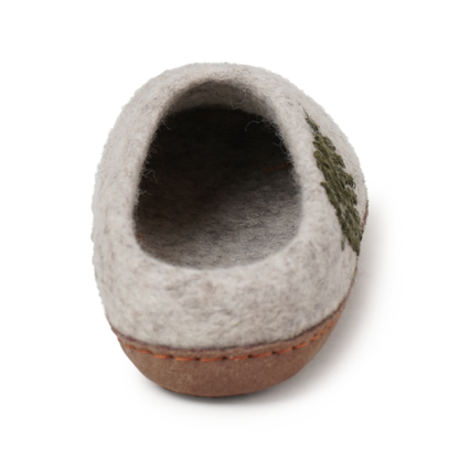 Back angle Ambler Valhalla wool slippers in heather silver with natural leather sole and felted fern design. 